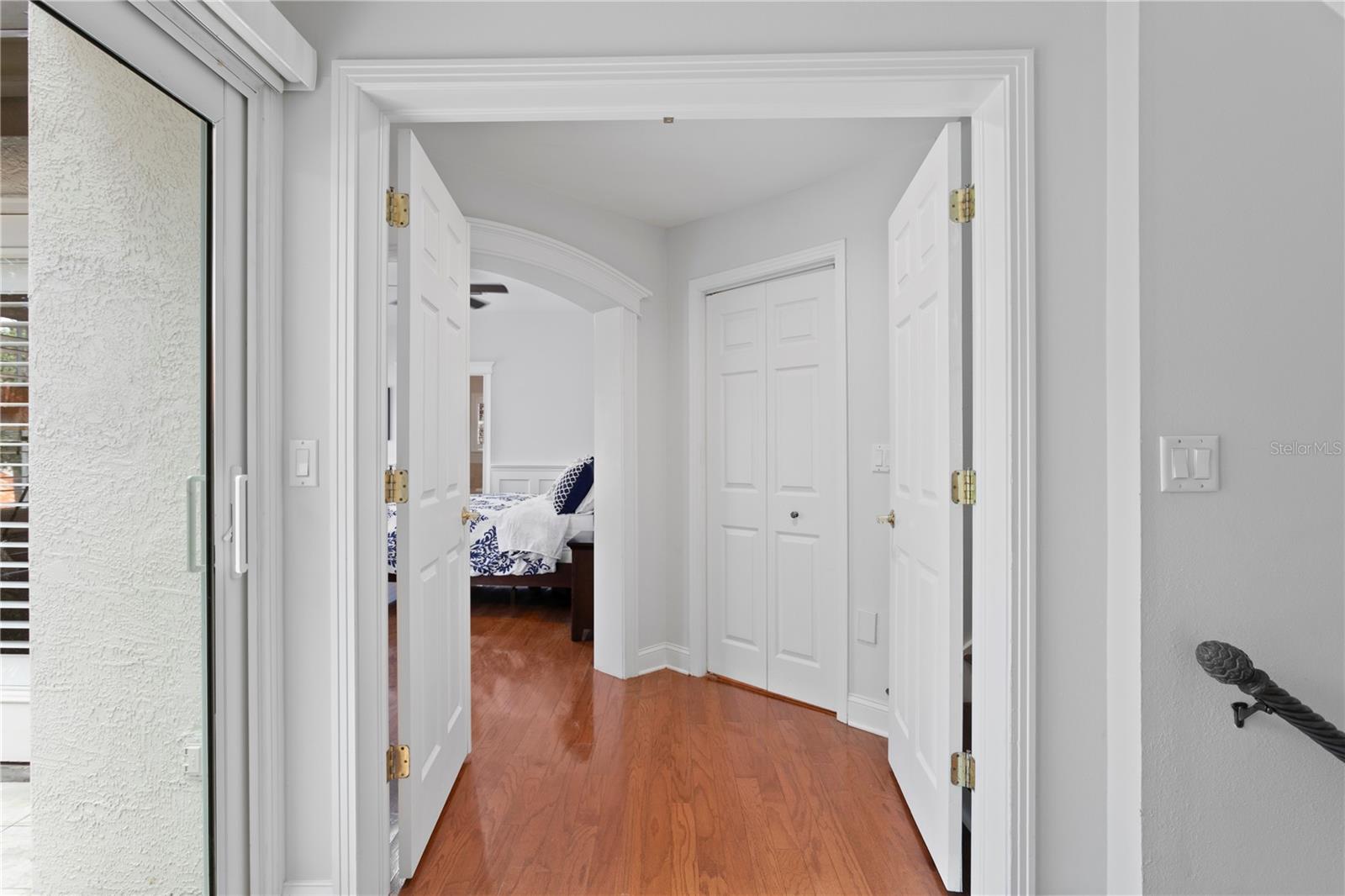 Double doors open to the private primary retreat.