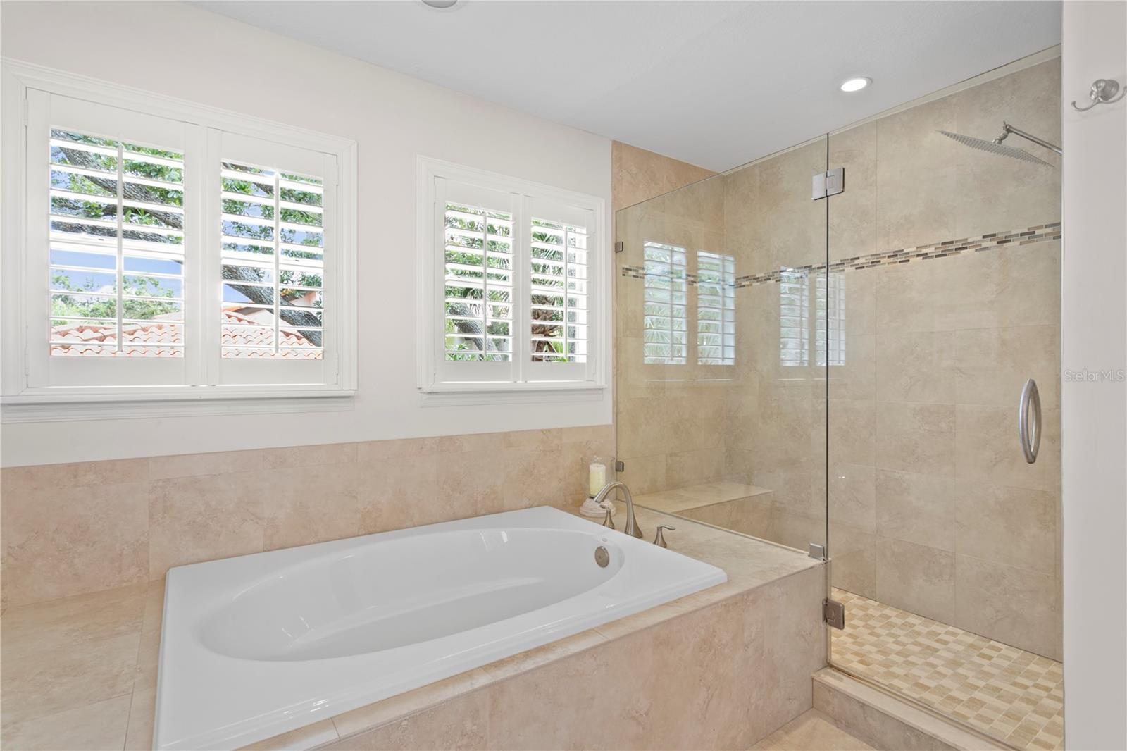 Enjoy the spa-like soaking tub and large shower with a rain showerhead.