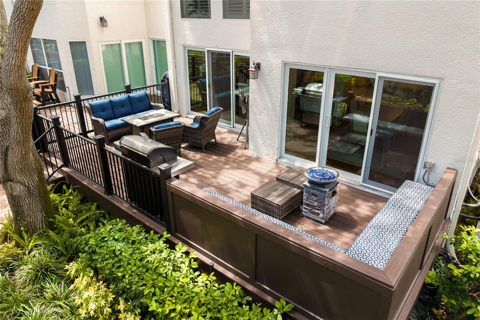 The spacious deck has plenty of room for entertaining, from lounging to grilling and everything in between.
