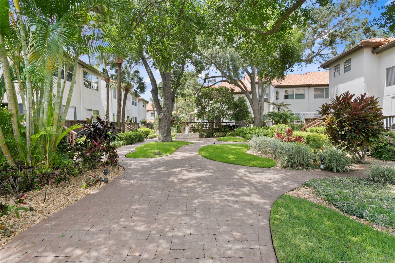 Brick pavers add charm and continuity throughout the community, lining the central courtyard as well as each driveway and front walkway.