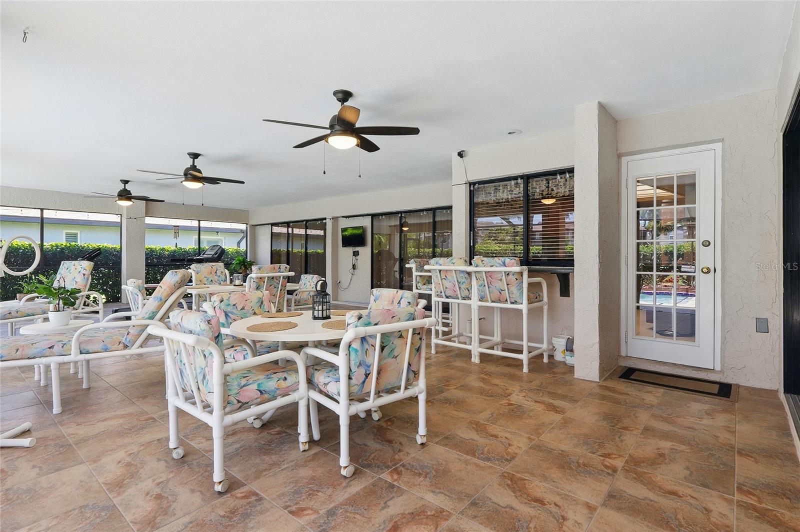 Screened in patio with a pool