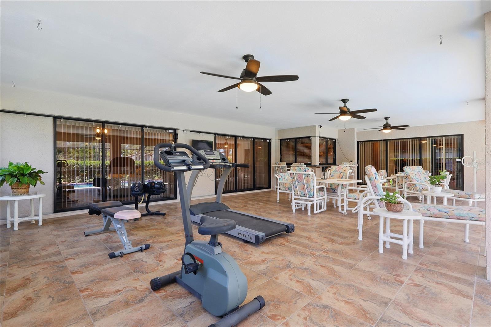 Screened in patio with a pool