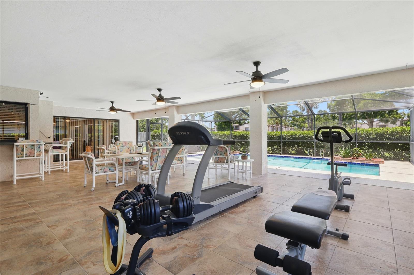 Screened in patio with a pool