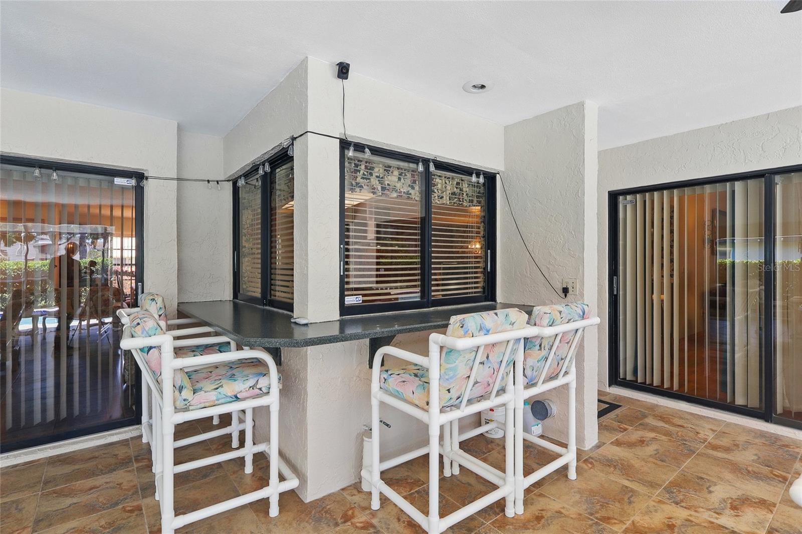 Screened in patio with a pool