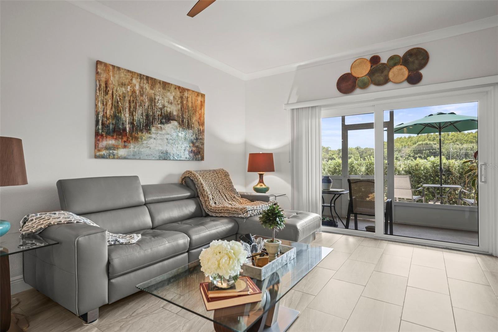 Living room with slider to screen lanai and patio