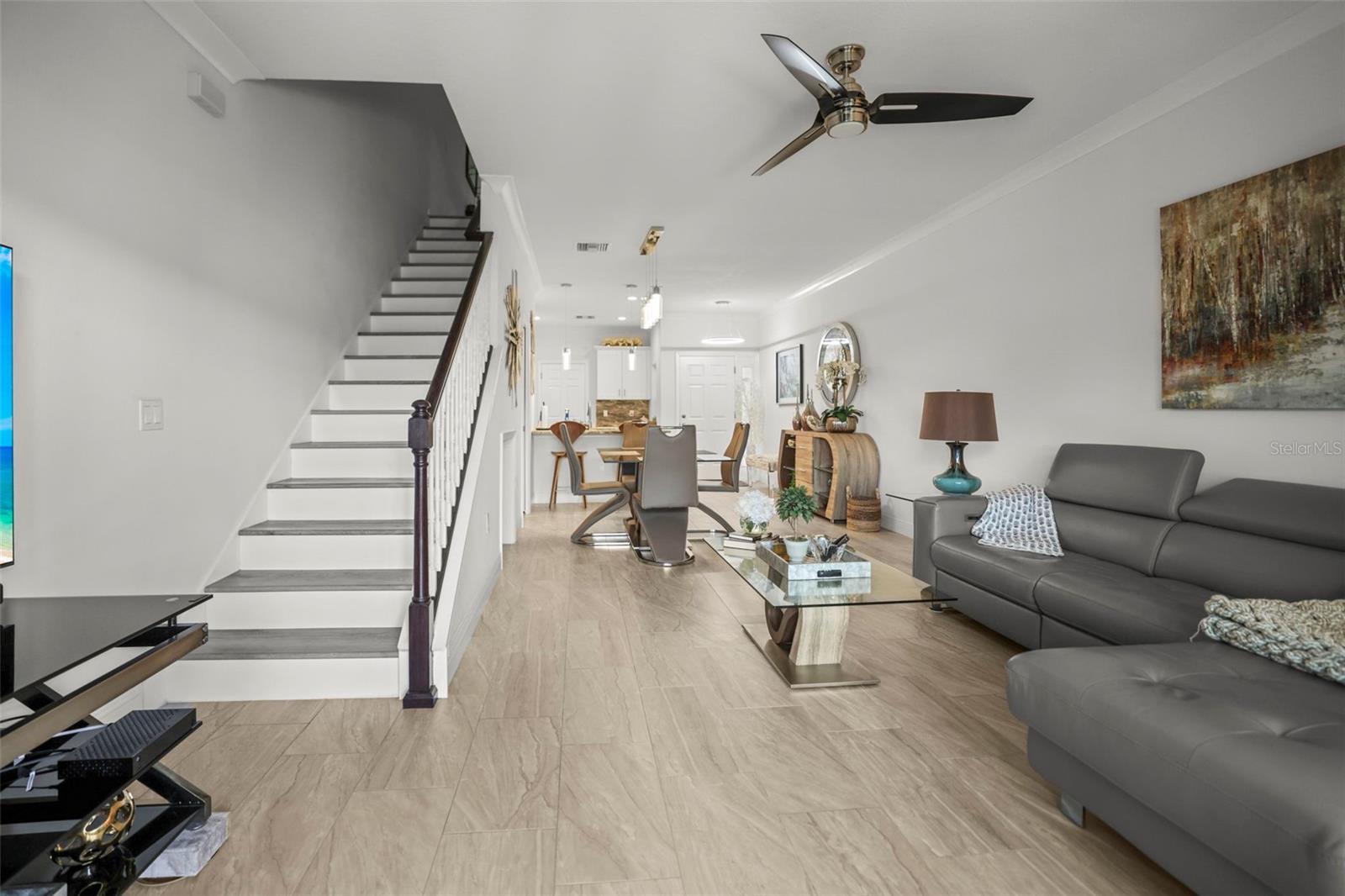 Living room with staircase to second level