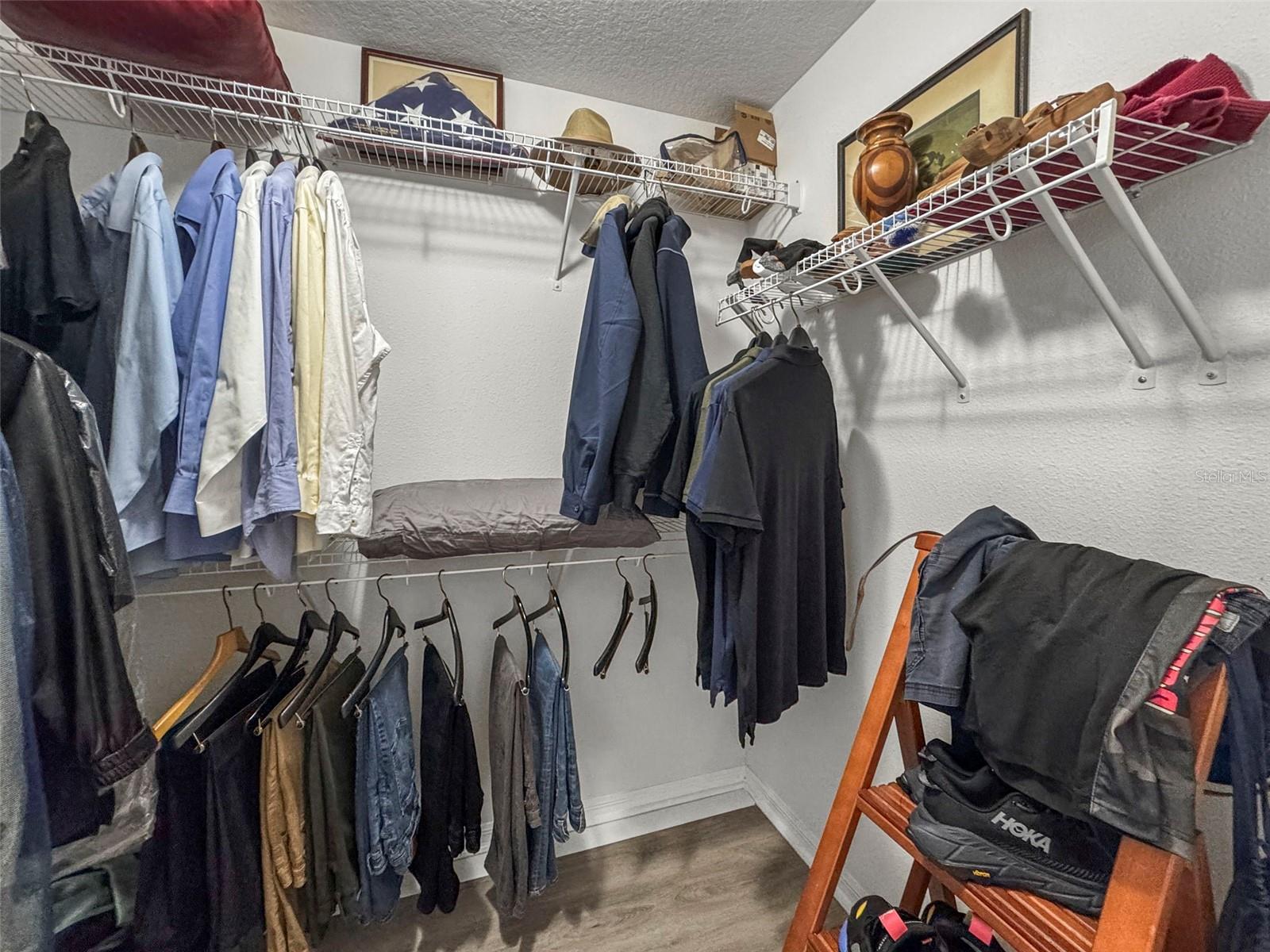 Walk in closet in primary bedroom