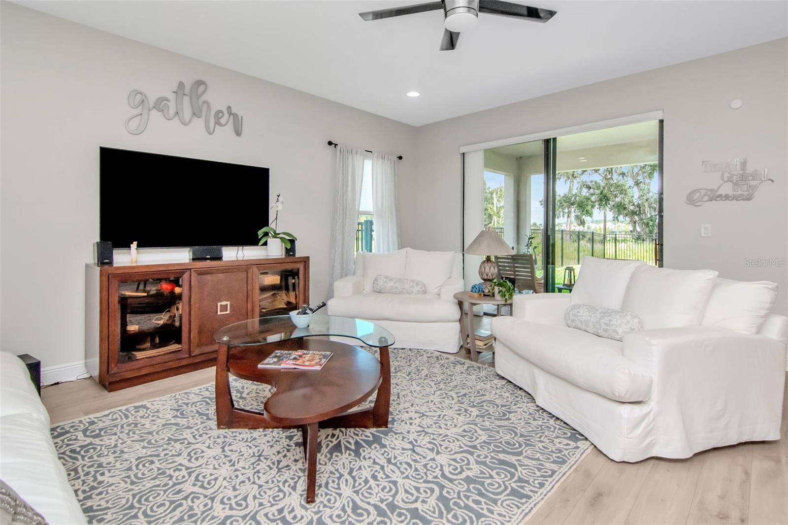 Living Room sliders beckon to the Lanai & Large Yard