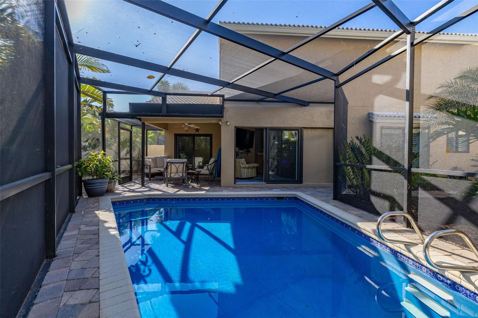 Screened in Pool Area looking towards covered Patio Area