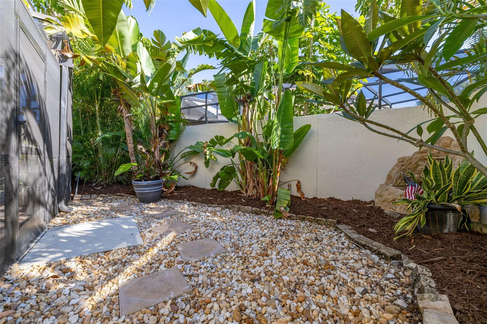 Courtyard Area to the Right of Screened Enclosure
