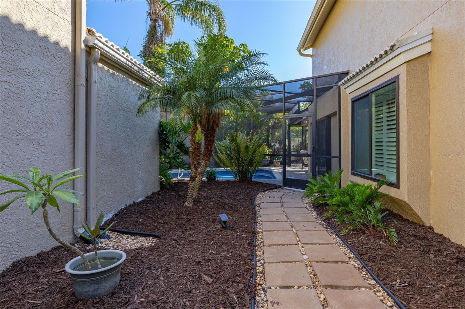 Courtyard Area to Left of Screened Enclosure