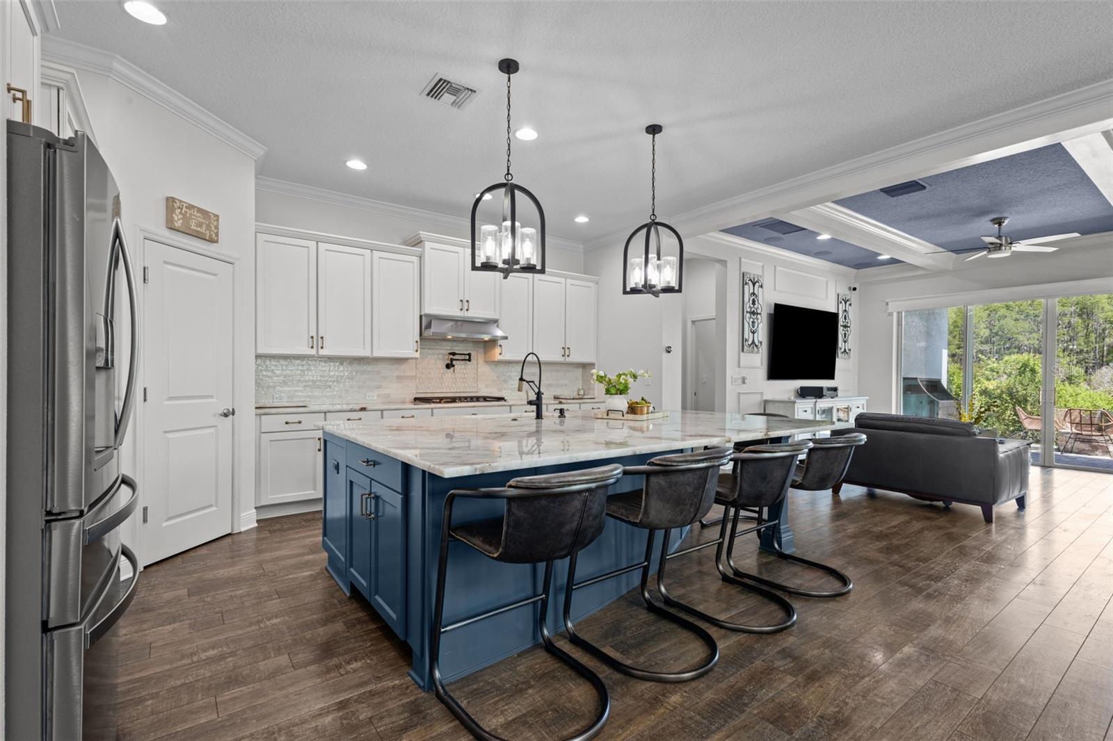 Kitchen showing open concept to living and dining areas