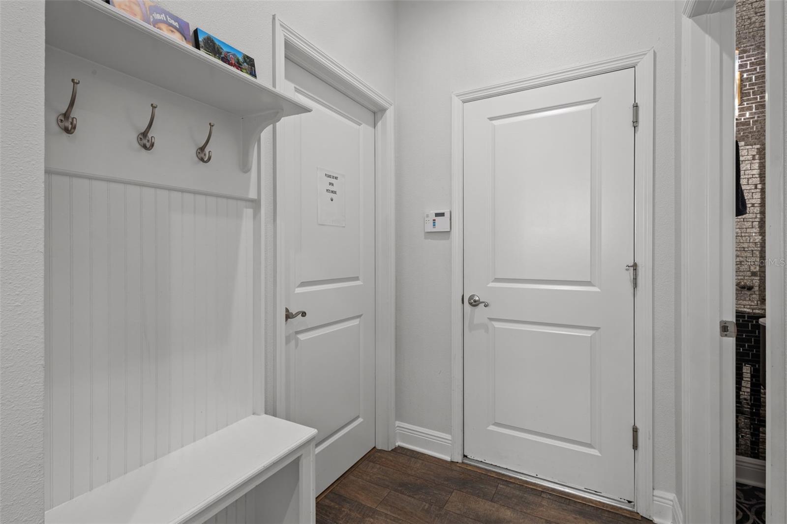 Drop Zone - door on left is to laundry, door center is to 3 car tandem garage, door on right is to bathroom 3 - half bath