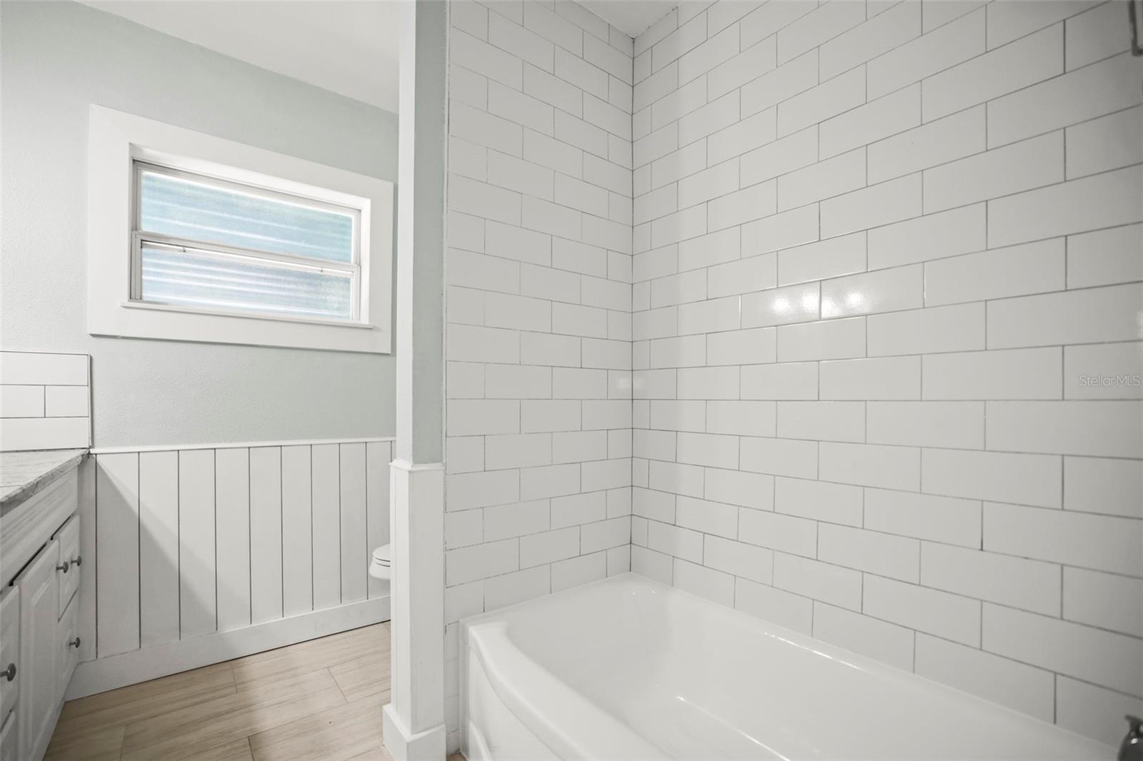 Shower Tub combo in this completely updated bath