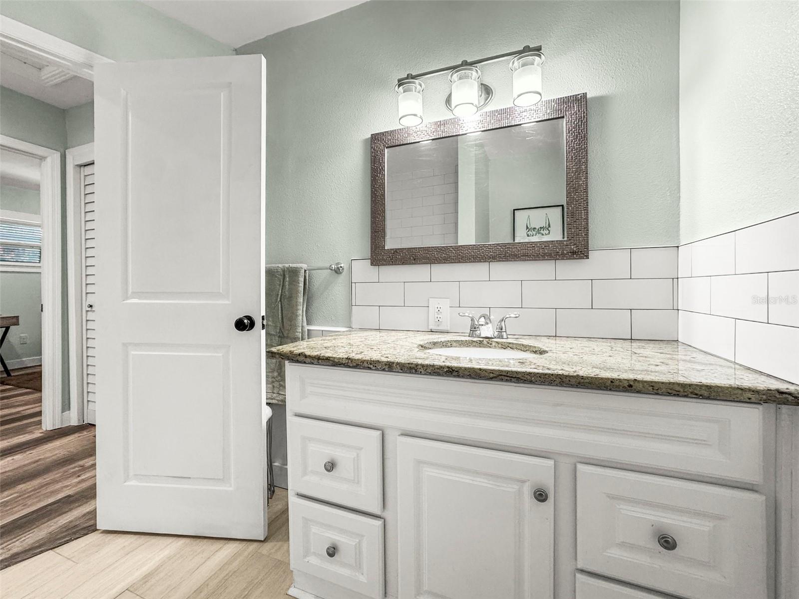 Updated bathroom with new vanity and flooring
