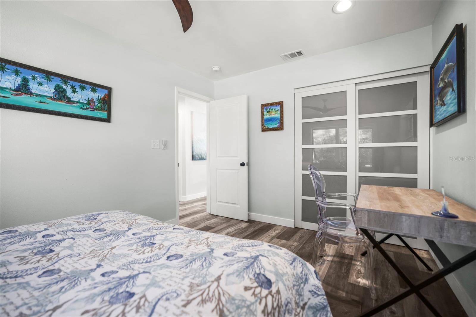 Primary Bedroom with stylish glass closet doors