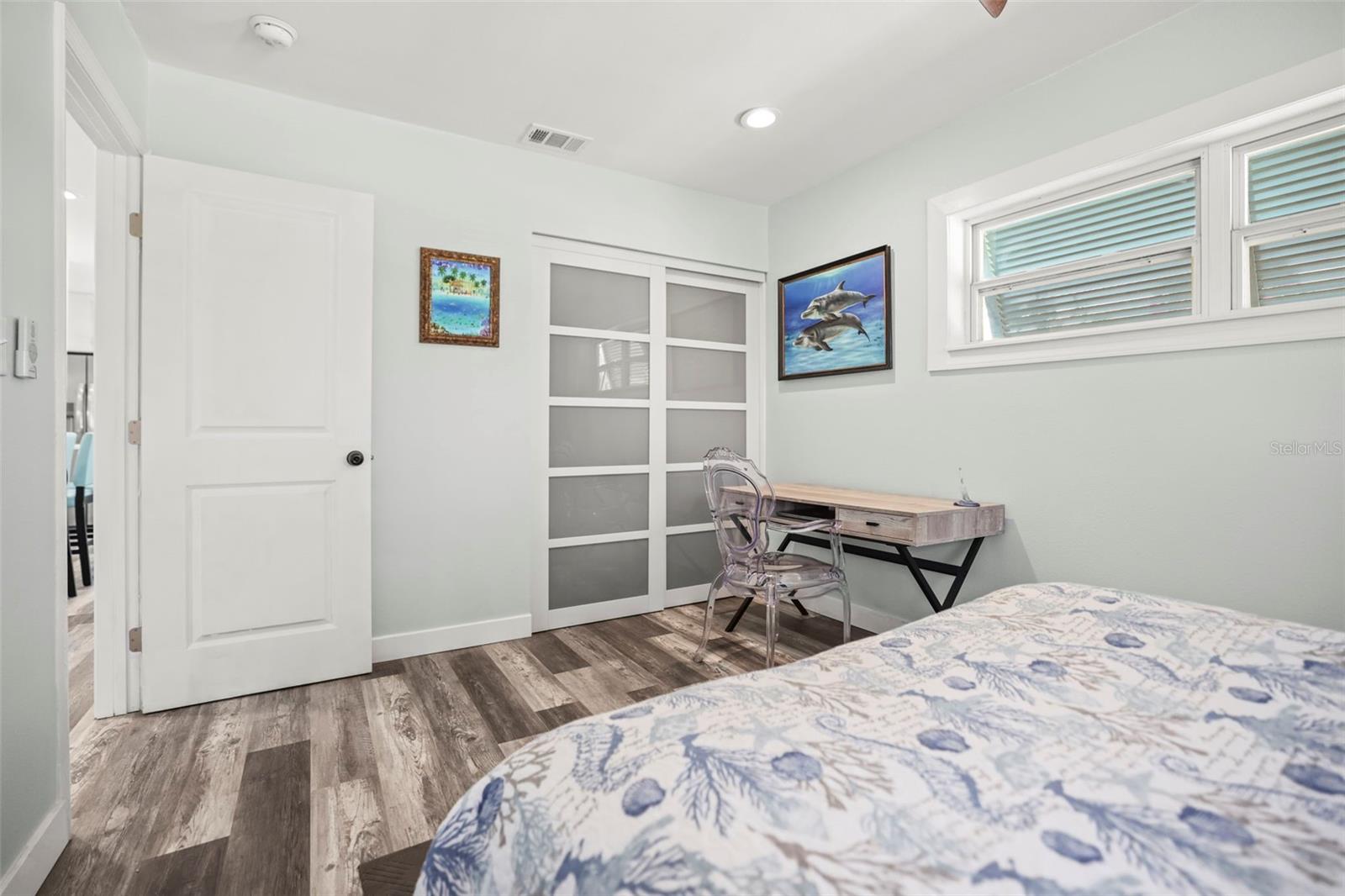 Primary Bedroom with stylish glass closet doors
