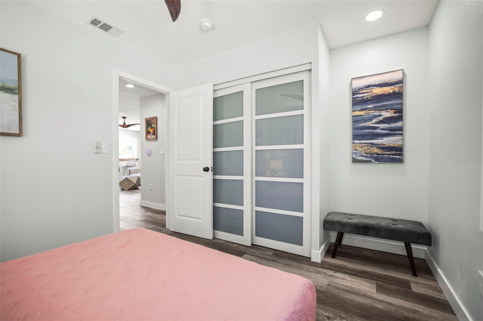 Bedroom 2 with stylish glass closet doors