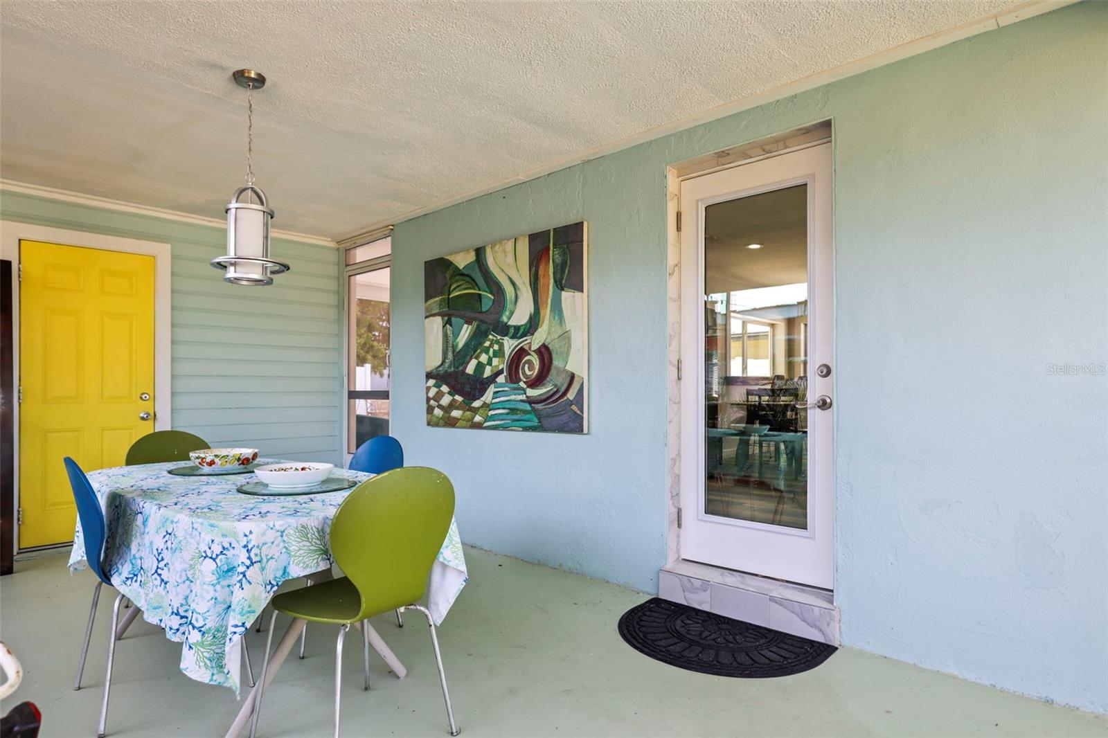 Quintessential Dunedin under cover entertainment spot with lush landscaping, right outside the kitchen door