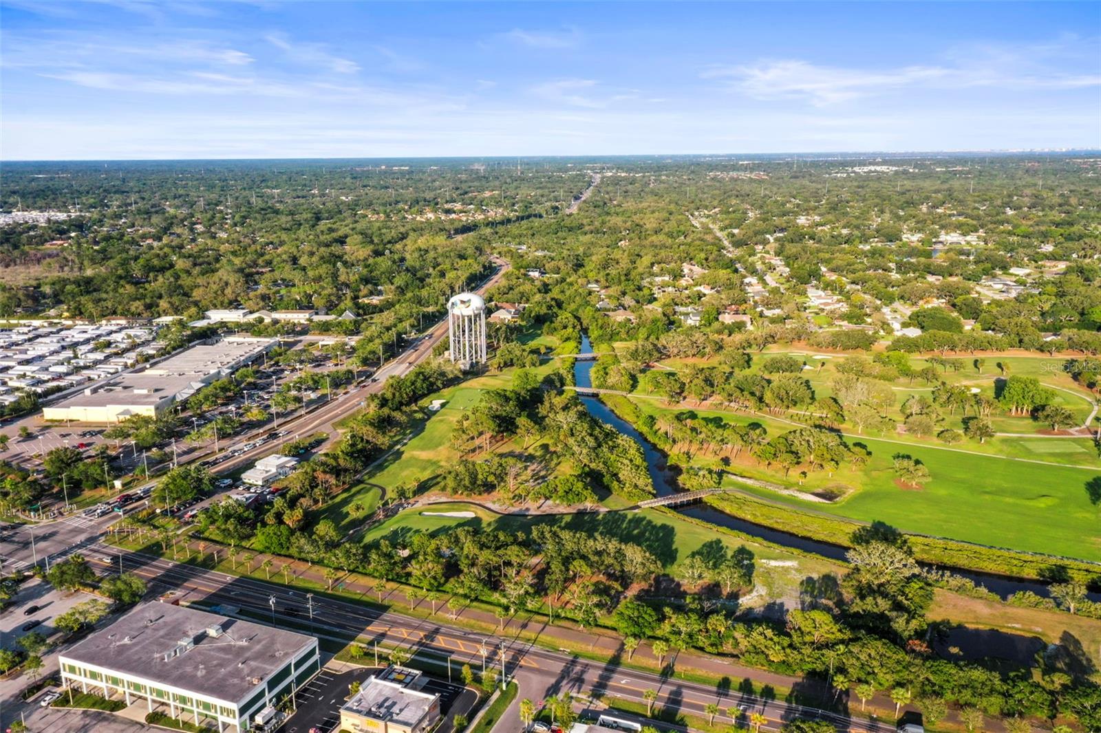 Drone shot showing how close you are to shopping and golf