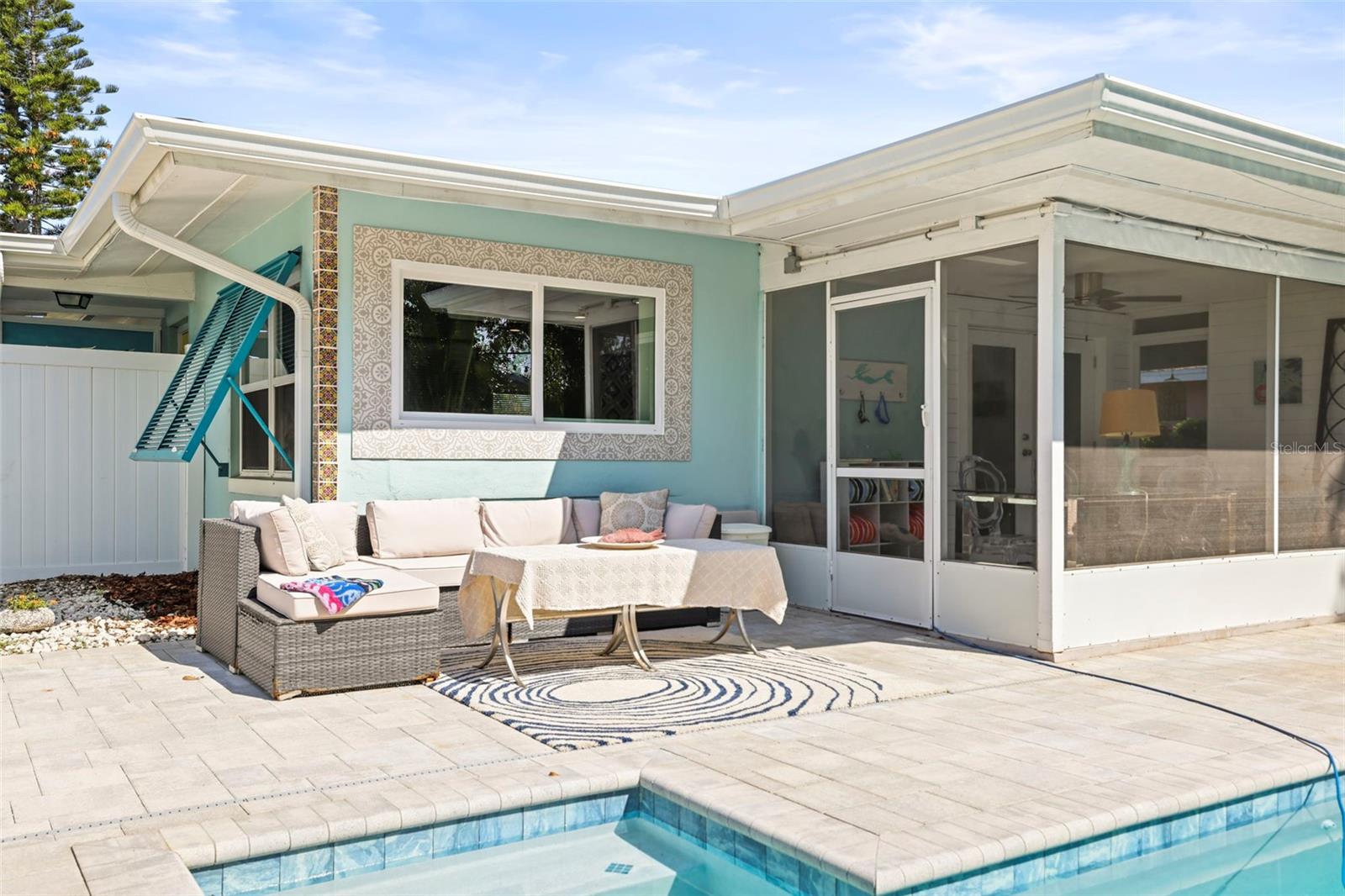 Screend lanai and outdoor seating at the pool