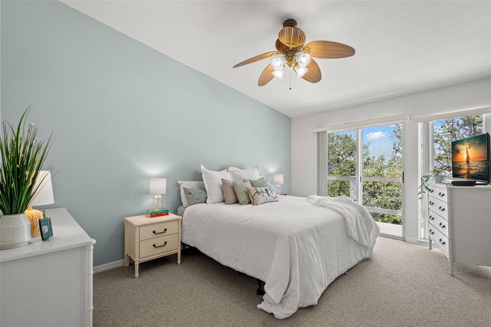 Primary bedroom facing balcony
