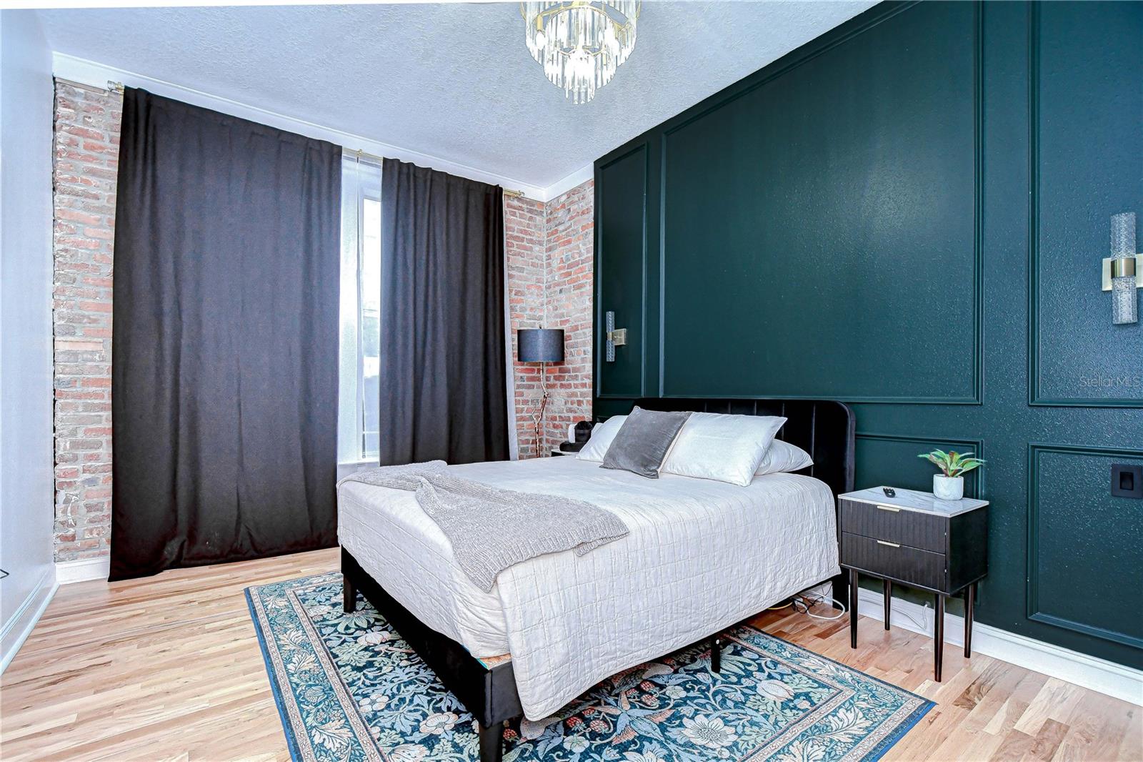 Guest bedroom features a walk in closet and partial view of the stage