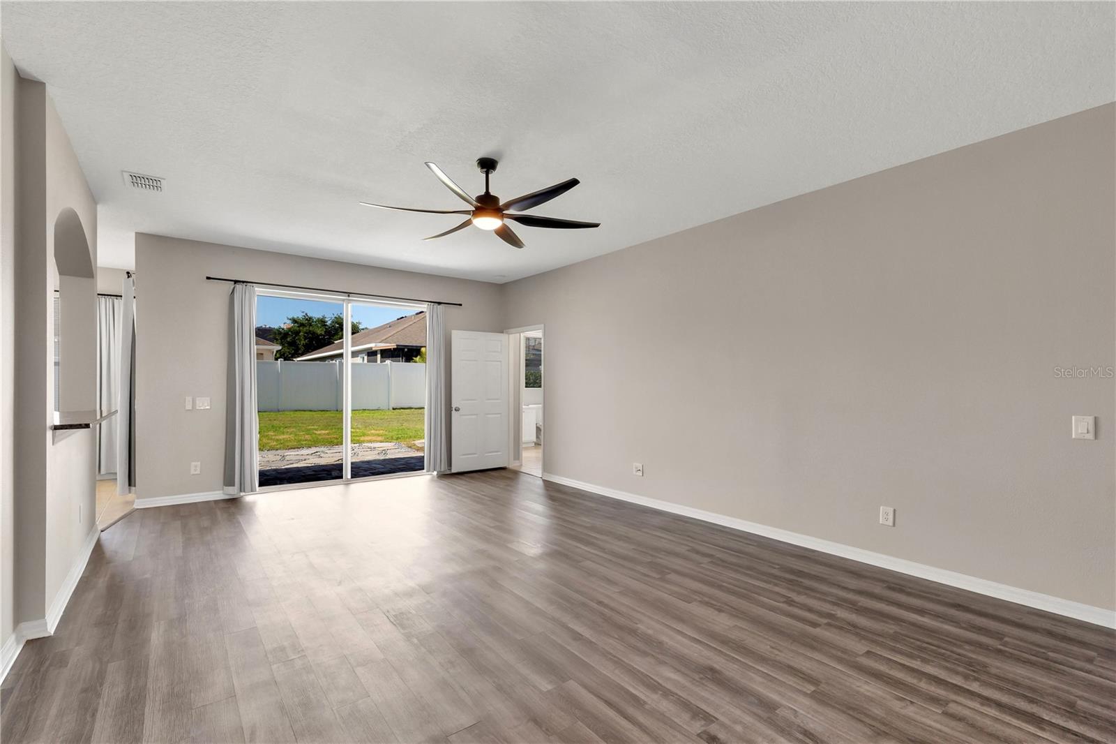 Great room overlooking backyard and patio