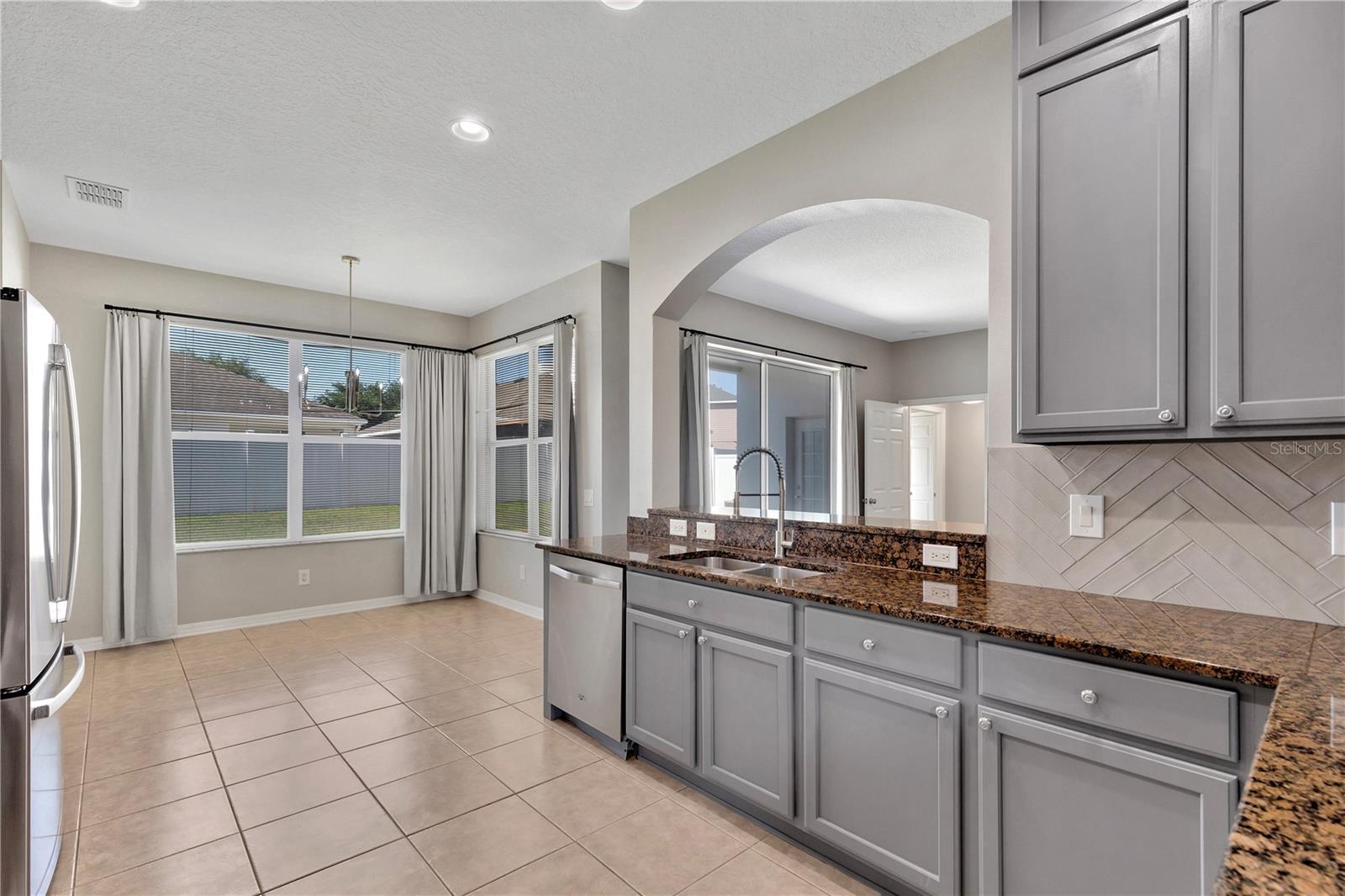 Kitchen with wood cabinets and pull outs