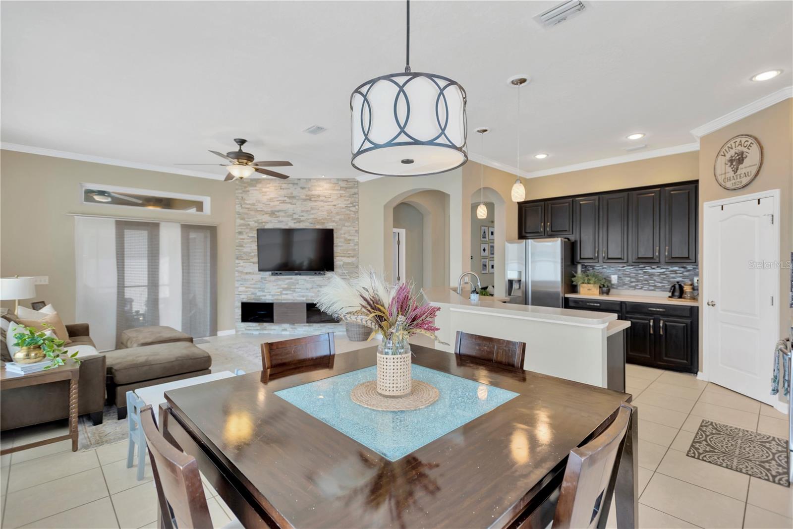 Bringing dining, family living area and kitchen together in the "heart of the house" with enchanting ambience.