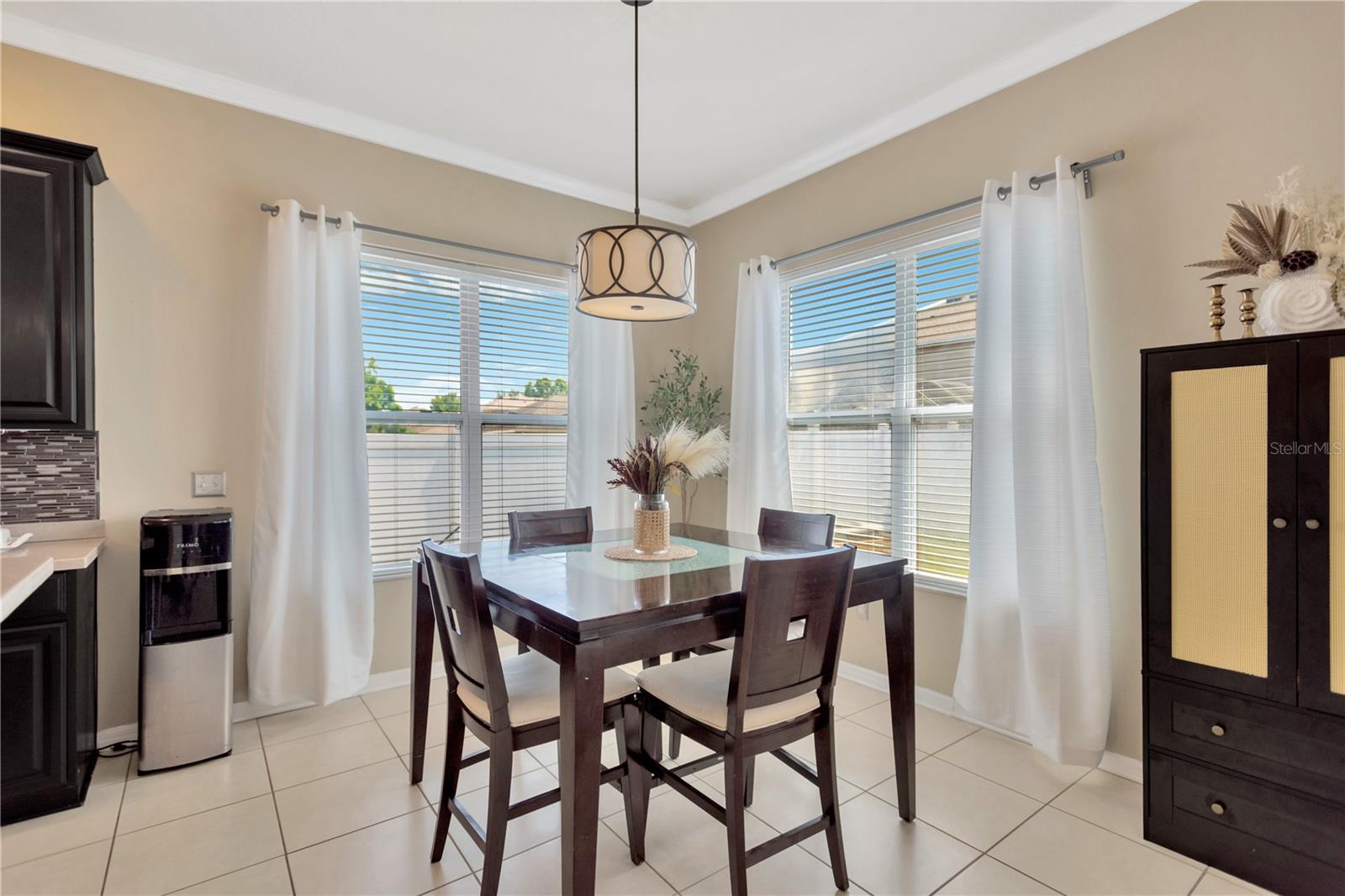 Eat in kitchen dining area is showcase by beautiful picture windows letting in sparkling natural light.