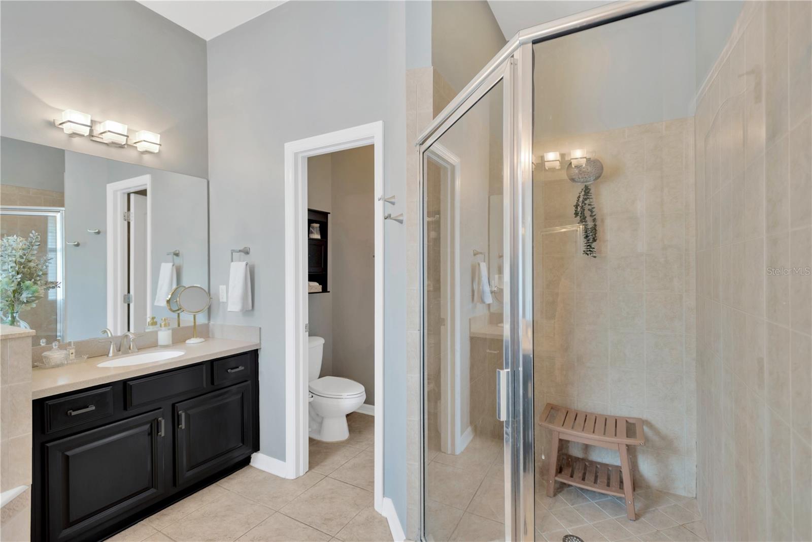 Private commode area and large tile glassed in shower complete this special Master Bath.