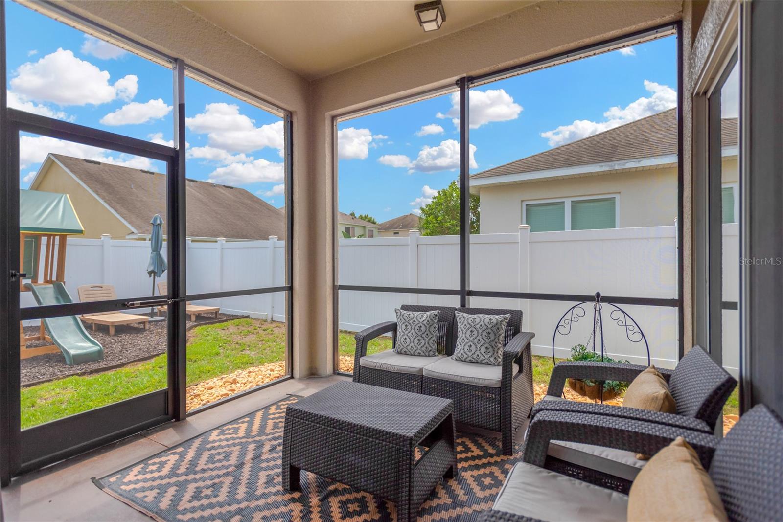 Enjoy the Florida outdoors in your covered screen room.