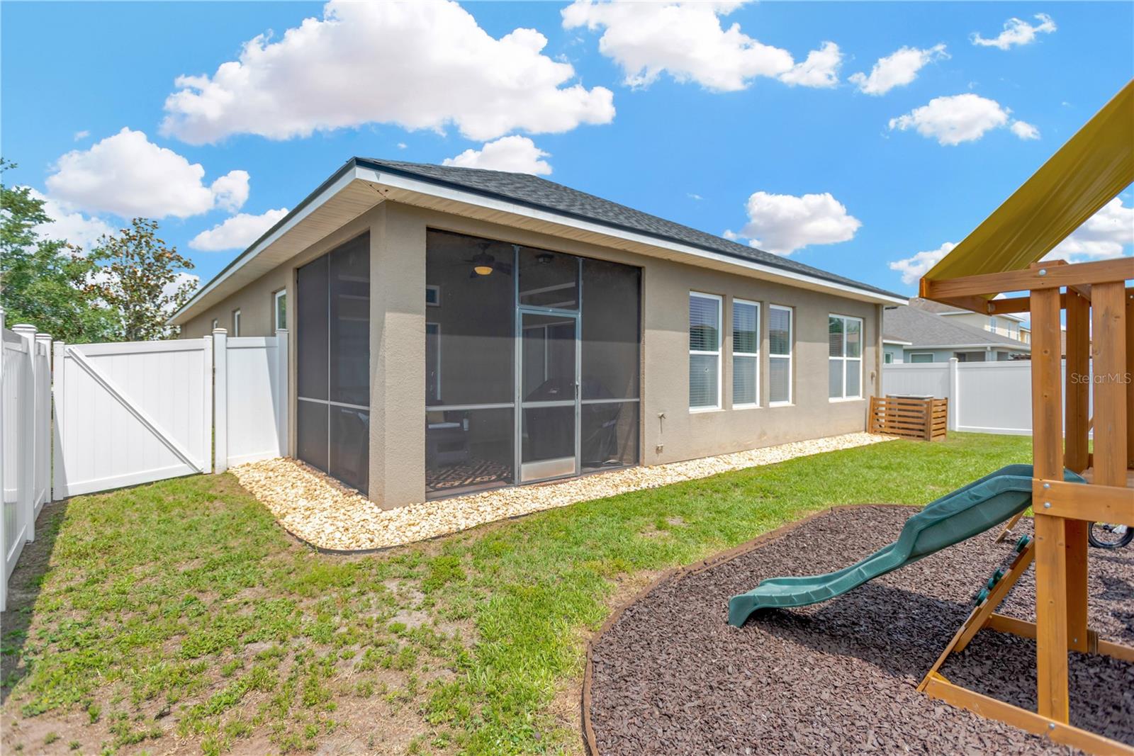 New vinyl screen fencing encloses the entire property ~ great for pets / children to enjoy.