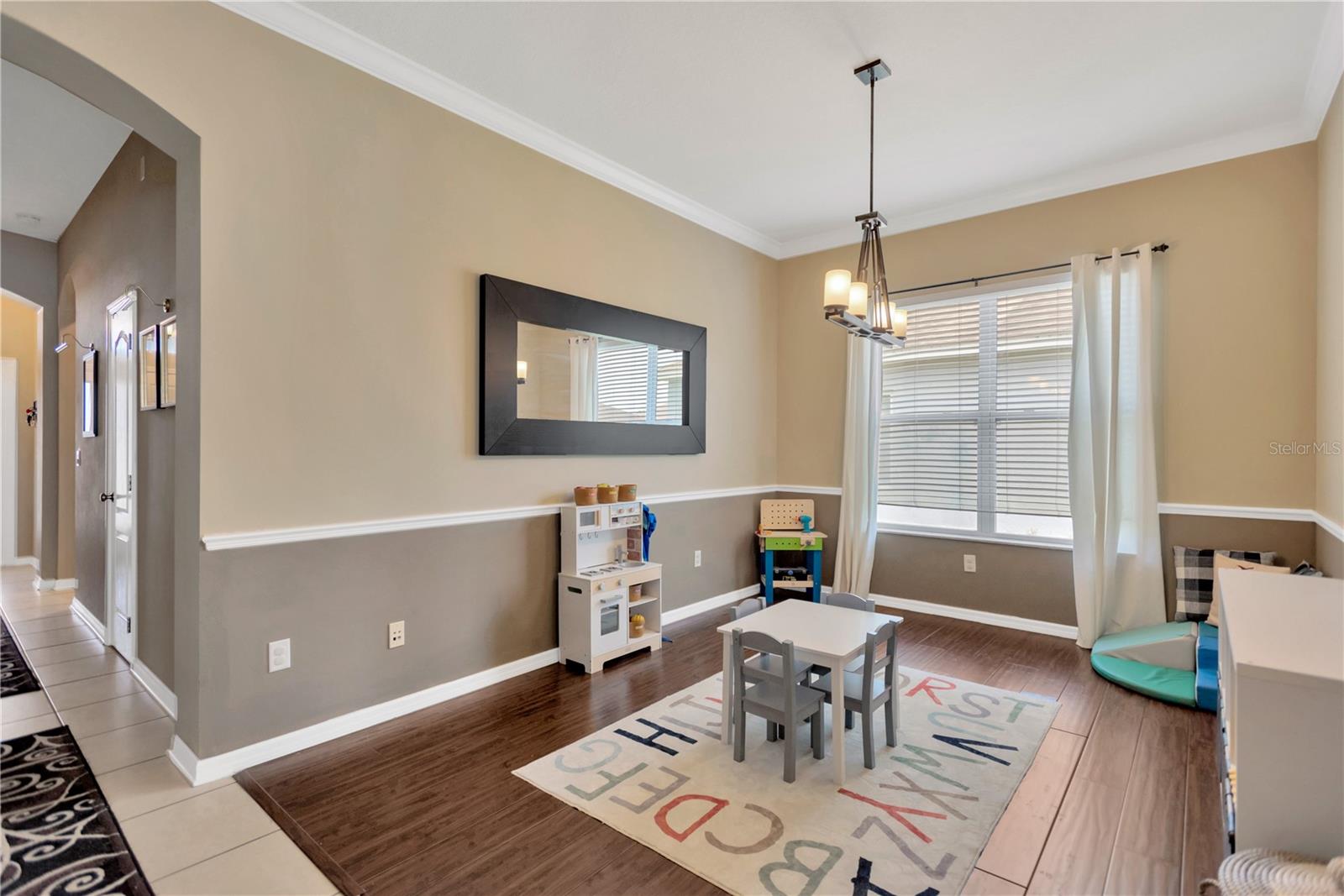 Doubling as a playroom, this space makes a wonderful dining room or additional sitting /TV area.