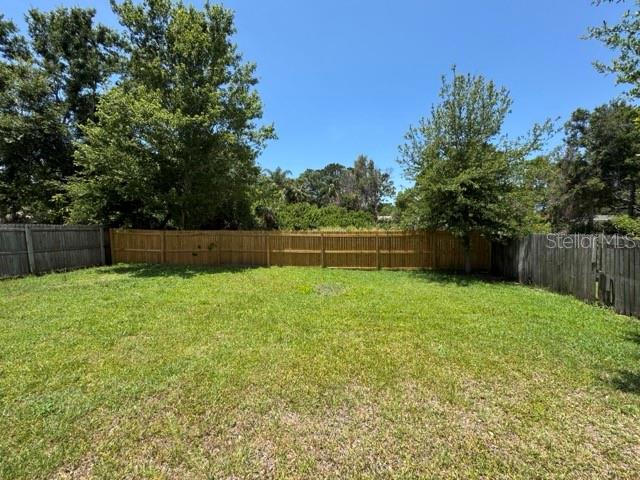 Large fenced backyard.
