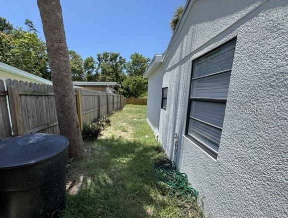 Left side of yard.