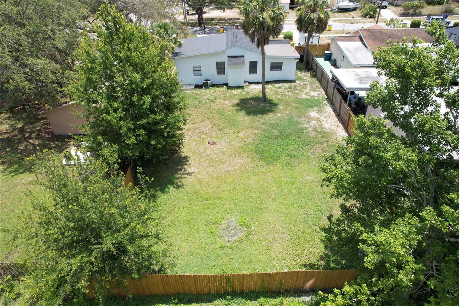 Drone shot of backyard.  Lots of room for a shed and/or pool.
