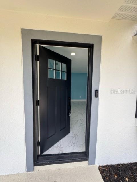 Entering in the front door.