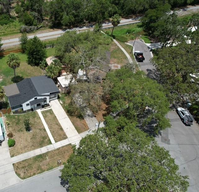 Aerial view showing home on left. The sidewalk from the front of the home to the right is the entrance to the Pinellas Trail.