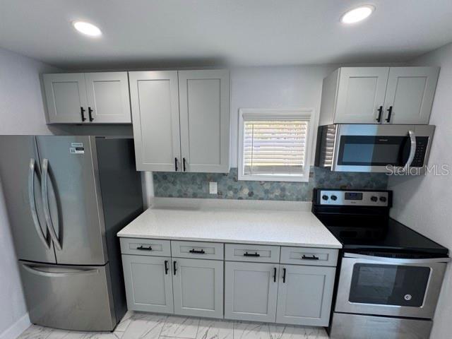 New Kitchen - Beautiful Quartz Counters & Backsplash. All new appliances.