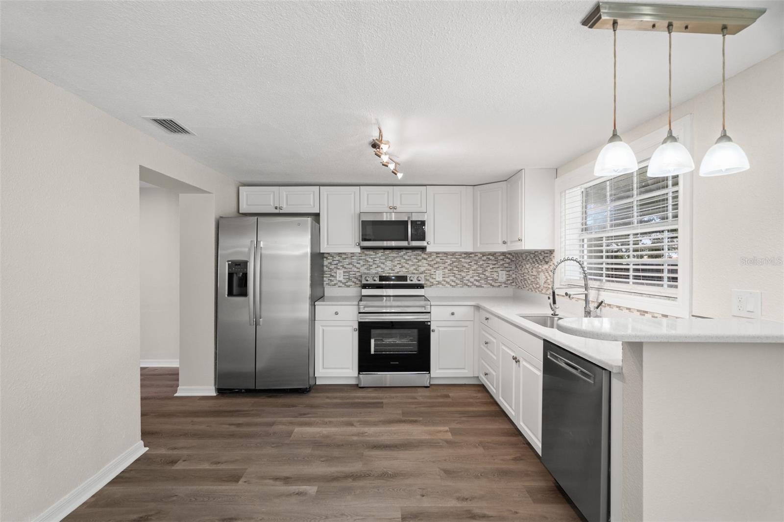 Kitchen Design w/Window To Backyard