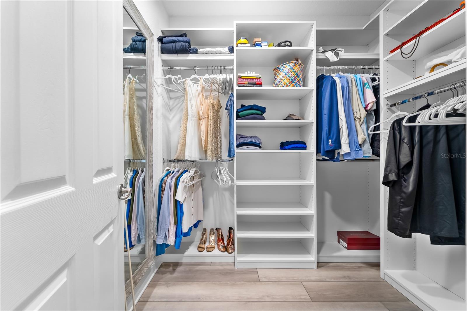 Huge custom closet in primary suite.