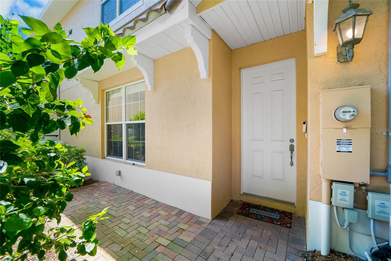Private paved area by the entryway.
