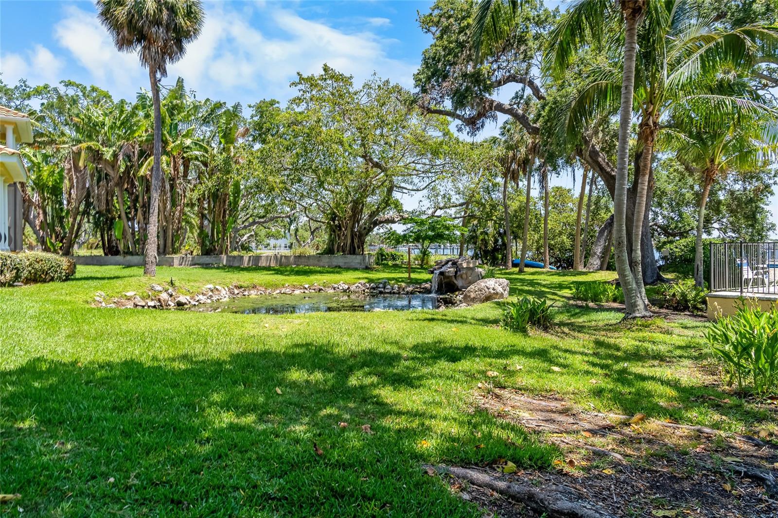 Beautifully landscaped including pond and waterfall.