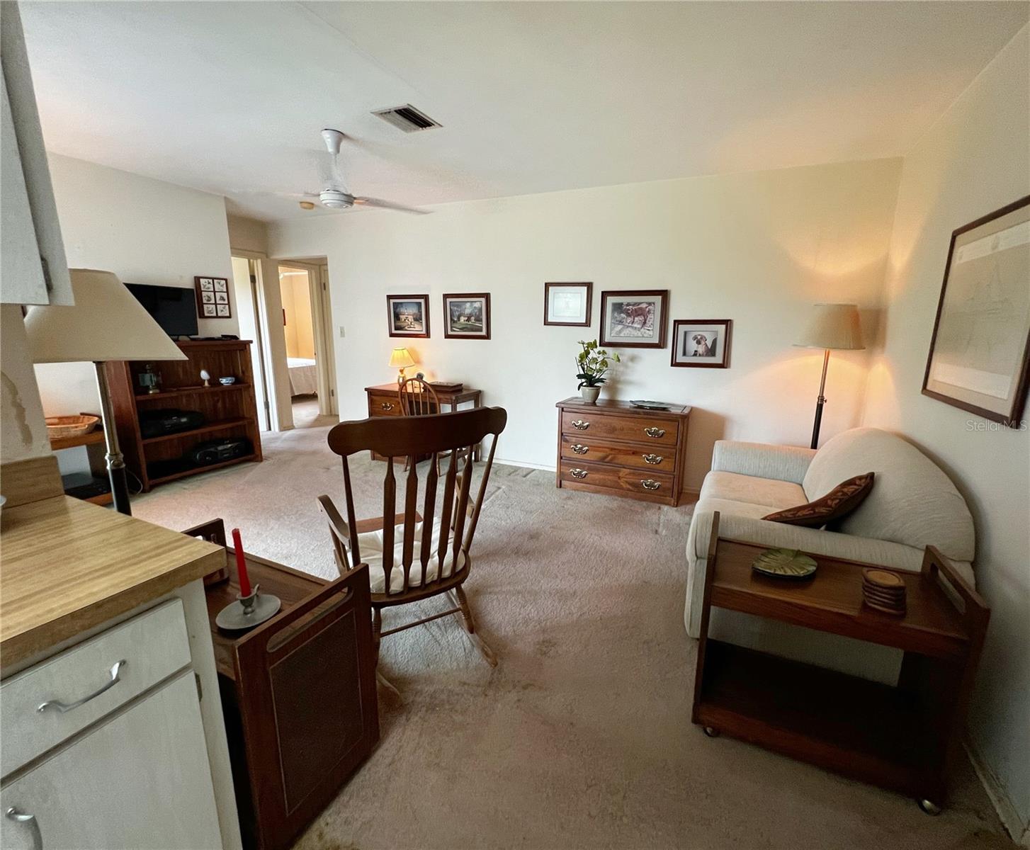 Family room right off of the kitchen. This leads to the other 3 bedrooms and common bathroom.