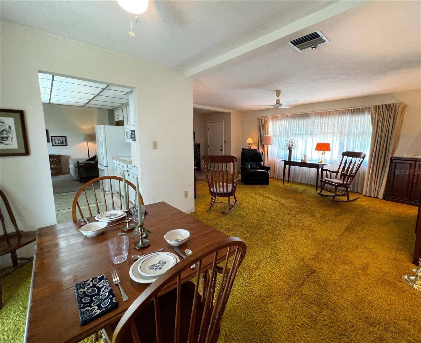 View into the kitchen and living room from the dining room