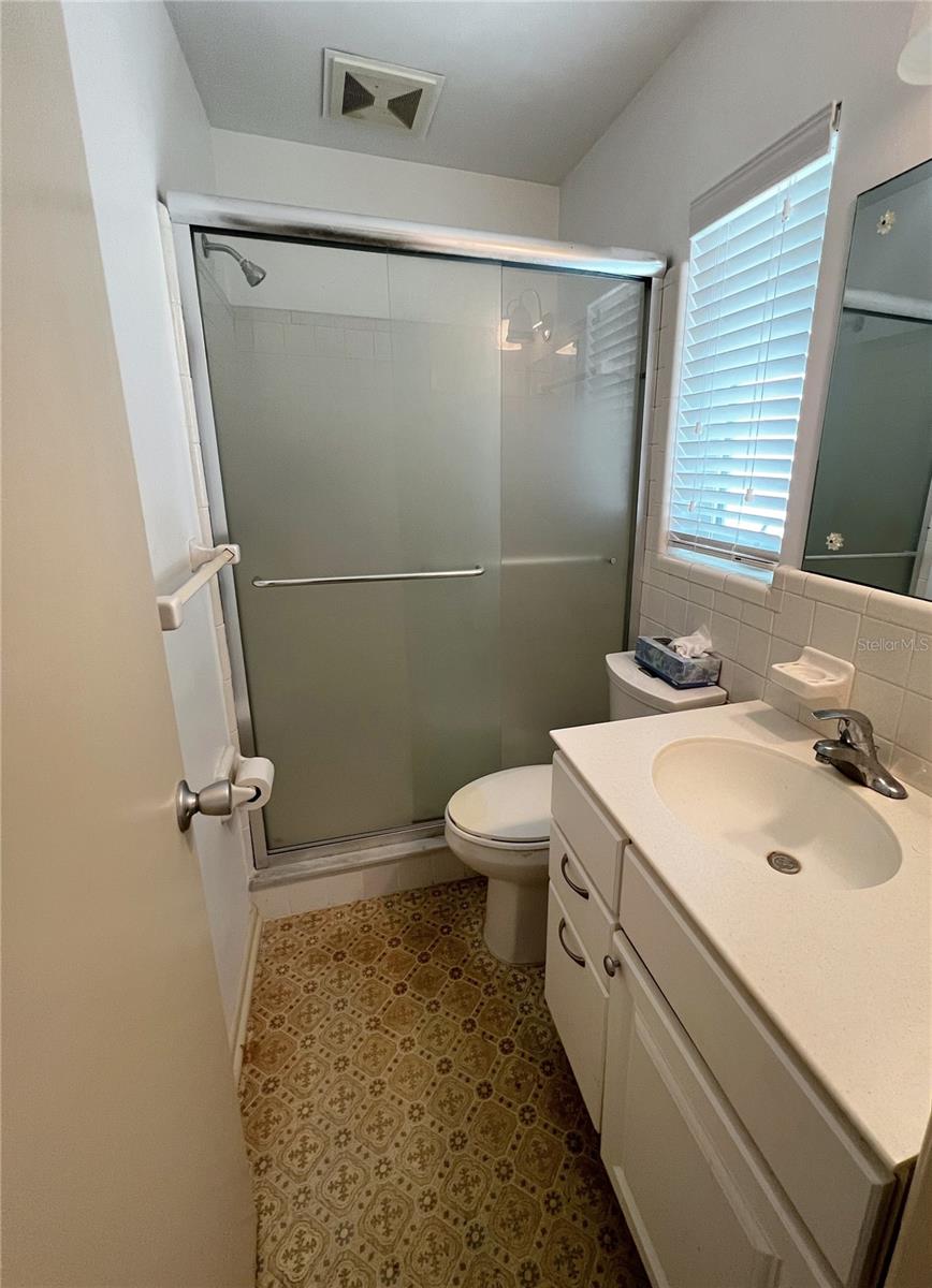 Attached Primary Bathroom with a walk in shower.