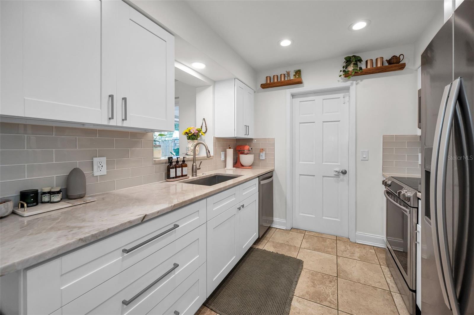 Renovated Kitchen with Shaker cabinets & Quartzite Countertops