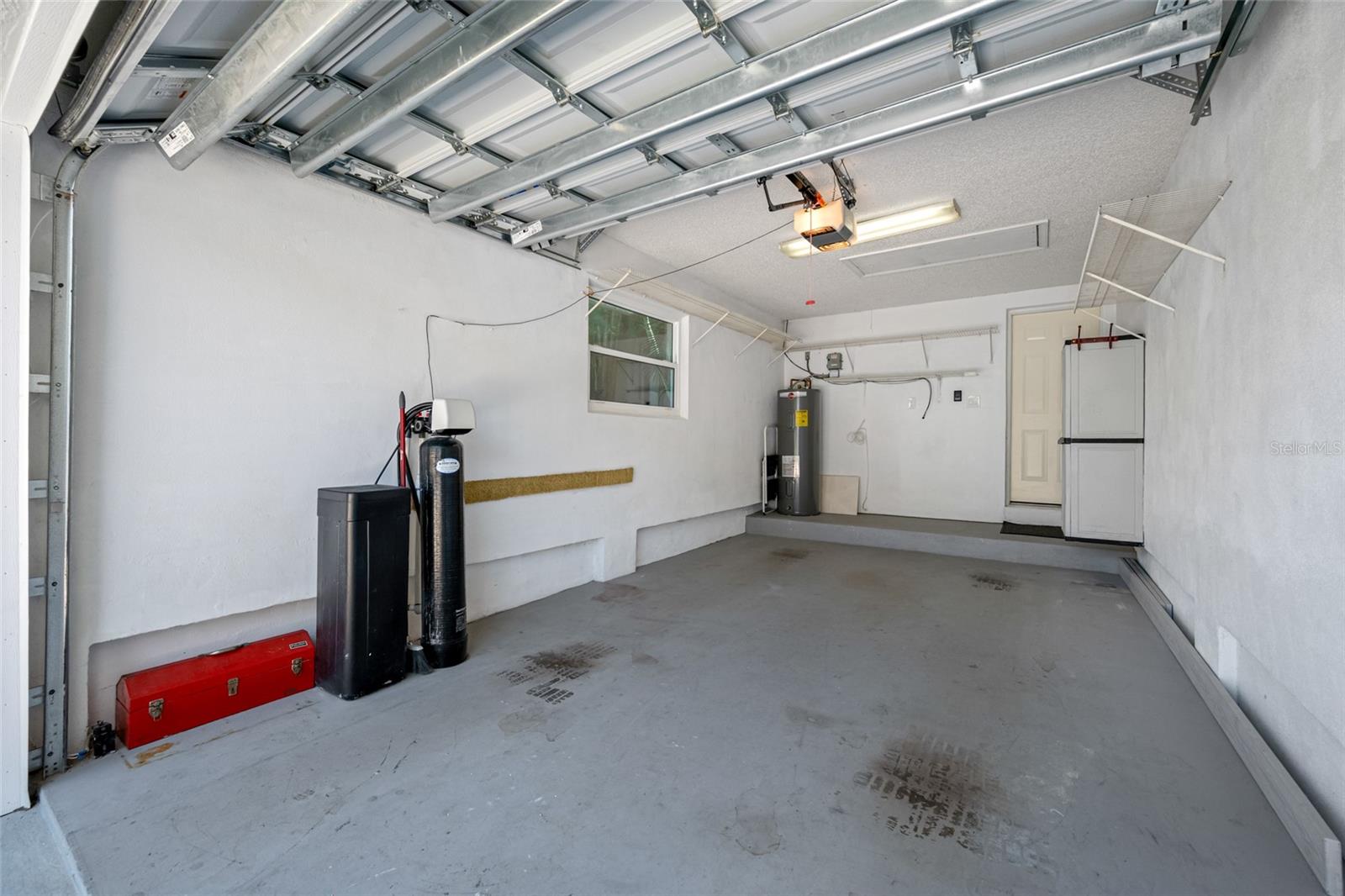 Private garage, with wind rated door. Water softener on left. Door in back opens directly to kitchen breakfast nook.